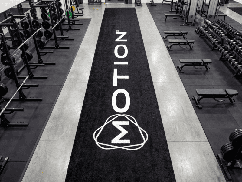 restoring gym turf fibers with a brush